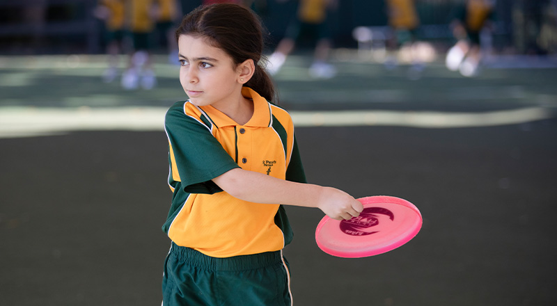 St Patrick's Catholic Primary School Parramatta student playing with frisbee
