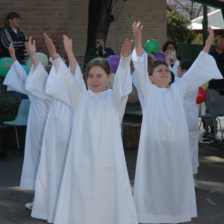 historical photo of St Patrick's Catholic Primary School Parramatta students celebrating in mass