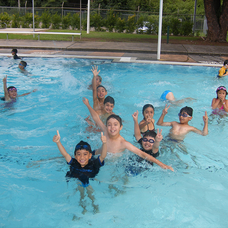historical photo of St Patrick's Catholic Primary School Parramatta students in a swimming carnival